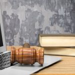 Laptop And Mallet On Table